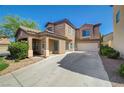 Beautiful two-story home featuring a covered porch, tiled roof, and an attached two-car garage at 5931 Allanche Ave, Las Vegas, NV 89141