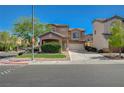 Charming two-story home with a well-maintained lawn, convenient two-car garage, and welcoming curb appeal at 5931 Allanche Ave, Las Vegas, NV 89141