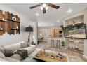 Stylish living room with a ceiling fan, open layout, and seamless transition to the kitchen area at 6581 Netherseal Ave, Las Vegas, NV 89139
