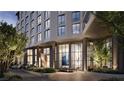 Elegant building entrance with modern architecture and lush landscaping at 700 W Carson Ave # 2307, Las Vegas, NV 89106