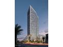 Stunning exterior shot of modern high-rise against a vibrant sky and landscaping at 700 W Carson Ave # 2307, Las Vegas, NV 89106
