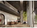 Grand lobby featuring high ceilings, stylish reception area, and a stunning tree feature at 700 W Carson Ave # 2307, Las Vegas, NV 89106