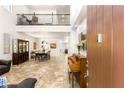 Inviting foyer with soaring ceilings, tile flooring, and views of the dining and living areas at 749 Middle Beach St, Las Vegas, NV 89138