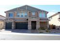 Beautiful two-story home featuring a two-car garage and welcoming front porch at 7855 Skyler Falls Ln, North Las Vegas, NV 89084