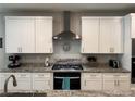 Modern kitchen featuring stainless steel appliances and granite countertops at 7855 Skyler Falls Ln, North Las Vegas, NV 89084
