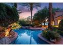 Beautifully landscaped backyard featuring a stunning pool, spa, and lush greenery at 1 Via Mira Monte, Henderson, NV 89011