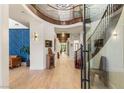 Grand foyer with a beautiful staircase, hardwood floors, and an open layout, perfect for welcoming guests at 10301 Orkiney Dr, Las Vegas, NV 89144