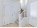 Bright entryway features tile flooring and a staircase leading to the second floor at 11221 Victoria Medici St, Las Vegas, NV 89141