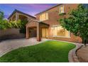 Expansive backyard features artificial turf and covered patio, perfect for outdoor entertaining at 11847 Corenzio Ave, Las Vegas, NV 89138