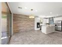 Bright kitchen with stainless steel appliances, island and an adjacent dining area at 11847 Corenzio Ave, Las Vegas, NV 89138