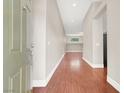 Inviting entryway with wood-look flooring and neutral paint, leading to a bright and open living space at 1212 E Rome Blvd, North Las Vegas, NV 89086