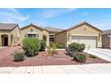 Beautiful single-story home featuring desert landscaping and an attached two-car garage at 1212 E Rome Blvd, North Las Vegas, NV 89086