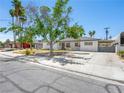 Charming single-story home featuring stucco walls, mature trees and gated access at 1704 S 8Th St, Las Vegas, NV 89104