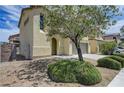 Inviting home featuring desert-friendly landscaping, an attached garage, and an appealing facade at 1952 W Hammer Ln, North Las Vegas, NV 89031