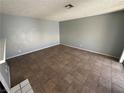 Neutral living room with tile flooring, and awaiting your personal touch at 227 N Lamb Blvd # A, Las Vegas, NV 89110