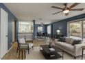 Inviting living room featuring neutral tones, a ceiling fan, and a sliding glass door to the backyard at 2349 Wooster Cir # A, Las Vegas, NV 89108