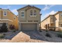 Two-story home featuring a two car garage and a brick driveway at 2785 Donatello Manor Pl, Henderson, NV 89044