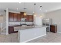 Well-equipped kitchen with stainless steel appliances and granite countertops at 2785 Donatello Manor Pl, Henderson, NV 89044