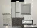 Selection of finishes includes white quartz, stone gray cabinets and drift wood flooring at 340 Taylor St, Henderson, NV 89015