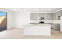 Modern kitchen features white countertops, an island and stainless steel appliances at 340 Taylor St, Henderson, NV 89015
