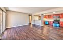 Open-concept living area with wood floors connecting to an eat-in kitchen, perfect for entertaining at 5021 River Glen Dr # 45, Las Vegas, NV 89103