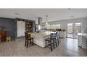Modern open kitchen featuring a large center island with bar seating and stainless steel appliances at 603 Palmhurst Dr, Las Vegas, NV 89145