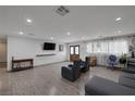Bright living room with hardwood floors, recessed lighting, and access to outdoor area at 603 Palmhurst Dr, Las Vegas, NV 89145
