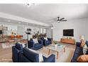 Bright open-concept living room seamlessly connects to a kitchen with modern finishes and stylish decor at 6305 Fairwood Ave, Las Vegas, NV 89107