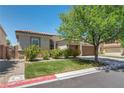 Charming single-story home featuring a well-kept lawn, desert landscaping, and a convenient two-car garage at 6423 Grayback Dr, North Las Vegas, NV 89084