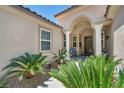 Inviting front entrance with well-manicured landscaping and a covered entryway at 6423 Grayback Dr, North Las Vegas, NV 89084