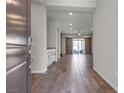 Inviting entryway with wood-look tile flooring, recessed lighting, and a view into the living space at 7072 Arabian Ridge St, Las Vegas, NV 89131