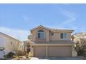 Charming two-story home with a three-car garage and desert landscaping at 9417 Grenville Ave, Las Vegas, NV 89134