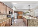Spacious kitchen with granite countertops, stainless steel appliances, and ample cabinet space at 9417 Grenville Ave, Las Vegas, NV 89134