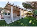 Spacious covered back patio with concrete flooring, offering an ideal outdoor living and entertaining space at 1409 Basin Brook Dr, North Las Vegas, NV 89032