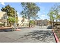 Gated community entrance featuring multiple units and lush landscaping on a sunny day at 1832 N Decatur Blvd # 104, Las Vegas, NV 89108