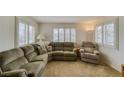 Bright living room with plush carpeting, white walls, and shuttered windows for natural light at 1944 Las Palmas Ln # 174, Laughlin, NV 89029