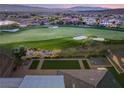 Picturesque view of lush golf course and meticulously maintained greenbelt from the home's rooftop at 20 Kittansett Loop, Henderson, NV 89052