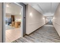 Inviting hallway leading to a modern condo featuring neutral tones and stylish carpeting at 211 E Flamingo Rd # 1617, Las Vegas, NV 89169
