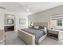 Inviting primary bedroom with a neutral color palette, a comfortable bed, and an attached bathroom at 295 Callen Falls Ave # 2225, Henderson, NV 89011