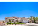 Beautiful single-story home featuring mature landscaping, a three-car garage and a tile roof at 3028 Treesdale Dr, Las Vegas, NV 89134