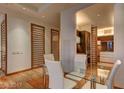 Dining area showcases a glass table with seating for four, with a partial view into the kitchen at 3750 S Las Vegas Blvd # 3111, Las Vegas, NV 89158