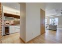 Hallway view includes modern kitchen, hardwood floors and a comfortable living room with floor to ceiling windows at 3750 S Las Vegas Blvd # 3111, Las Vegas, NV 89158