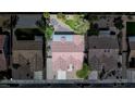 Aerial view of the home showcasing the red tile roof, backyard, and the surrounding neighborhood at 401 Obsidian St, Las Vegas, NV 89145