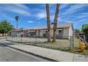 Charming single-story home with a gravel yard and mature palm trees at 4067 E Colorado Ave, Las Vegas, NV 89104
