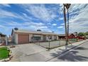 Charming single-story home with a gravel yard and mature palm trees at 4067 E Colorado Ave, Las Vegas, NV 89104