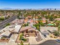 Scenic aerial view of a residential area with the city skyline in the background at 4475 Harmony Ct, Las Vegas, NV 89121