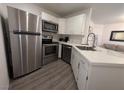 Modern kitchen with stainless steel appliances, sleek countertops, and ample cabinet space at 460 Elm Dr # 103, Las Vegas, NV 89169