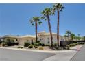 Charming single-story home with a tile roof, palm trees, and a lush landscaped yard at 4845 Santo Romeo St, Las Vegas, NV 89135