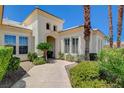 Welcoming front entrance with manicured shrubs and decorative trees at 4845 Santo Romeo St, Las Vegas, NV 89135