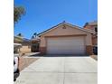Charming single story home with desert landscaping and a two-car garage at 5043 Naff Ridge Dr, Las Vegas, NV 89131